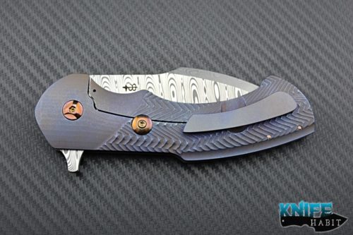 custom rick barrett fallout carry knife, blue anodized ripple frame scales, gold ano hardware, damascus blade
