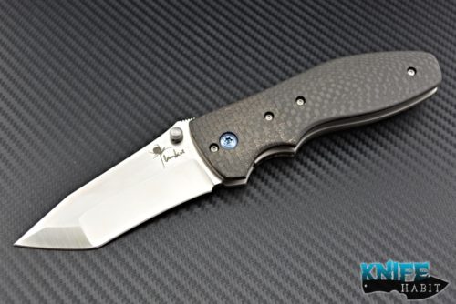 custom Kirby Lambert Orion MGT knife, copper light strike carbon fiber LSCF bolsters, carbon fiber scales, blue anodized hardware, compound grind blade