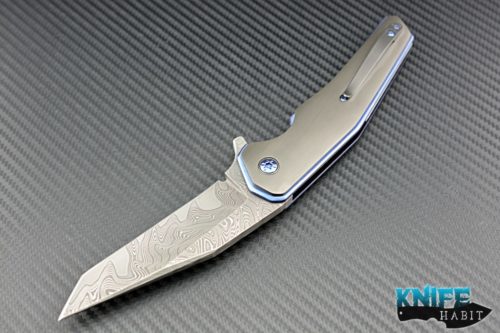 custom Les Voorhies Model 15 knife, zirconium scales, floating backspacer and clip, san mai damascus blade, blue anodized liner lock