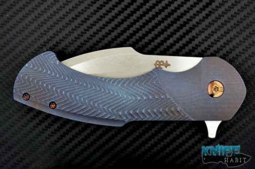 semi-custom Rick Barrett Fallout carry mid-tech knife, blue purple anodized scales, gold hardware, s35vn blade steel, polished flats stonewash blade grinds