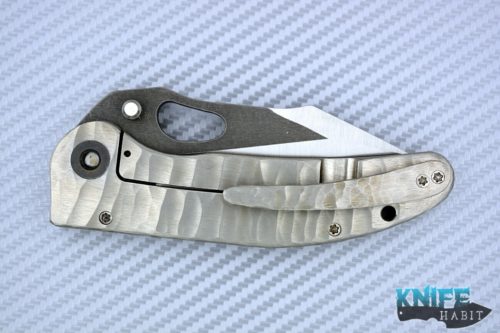 custom damjan eror small saurus knife, two-tone hollow grind, 3v blade steel, sculpted titanium handle