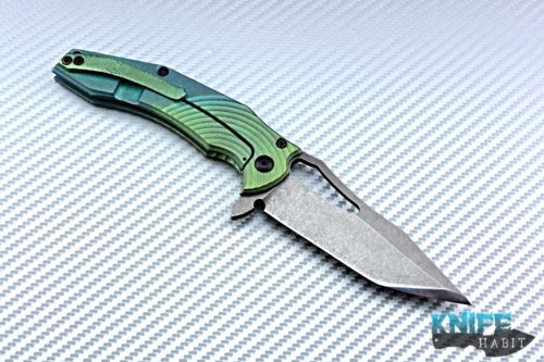 custom gavko spinner knife, thicker model, circle milling, anodized fade blue to green, acid washed aeb-l blade with polished tip