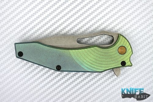 custom gavko spinner knife, thicker model, circle milling, anodized fade blue to green, acid washed aeb-l blade with polished tip