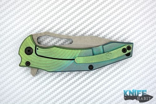 custom gavko spinner knife, thicker model, circle milling, anodized fade blue to green, acid washed aeb-l blade with polished tip