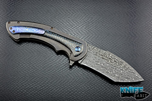 custom rick barrett full size fallout knife, stainless damascus blade steel, tumbled stonewashed titanium frame, blue mylar light strike carbon fiber inlays, timascus clip, blue anodized hardware