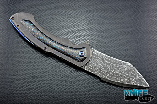 custom rick barrett full size fallout knife, stainless damascus blade steel, tumbled stonewashed titanium frame, blue mylar light strike carbon fiber inlays, timascus clip, blue anodized hardware