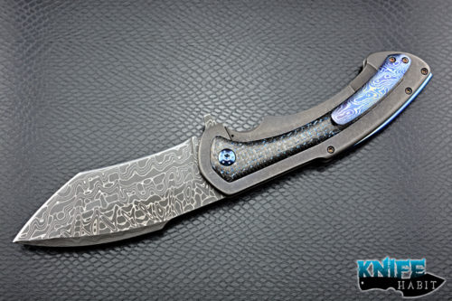 custom rick barrett full size fallout knife, stainless damascus blade steel, tumbled stonewashed titanium frame, blue mylar light strike carbon fiber inlays, timascus clip, blue anodized hardware