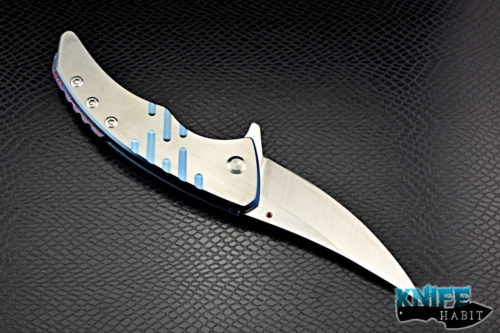 custom sergey rogovets model 19 knife, blue anodized milled titanium frame, cts-xhp blade steel, satin finish, mokuti backspacer, copper pivot collar and inlay