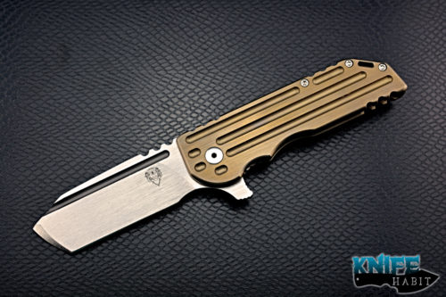 custom alphahunter tactical design color series warhorse, gold anodized milled titanium frame, satin 3v blade steel