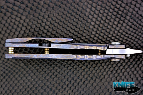 custom dalibor bergam draco knife, colorful anodized tree bark texture titanium frame, satin 3v blade steel