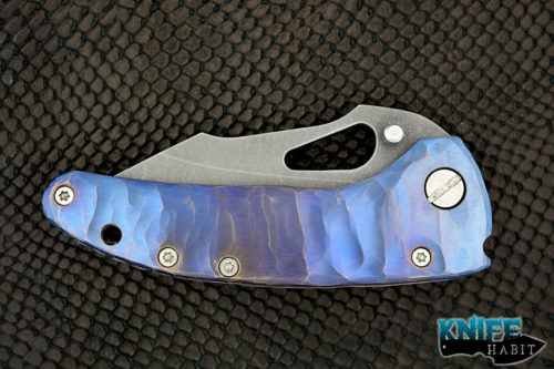 custom damjan eror small saurus knife, blue purple anodized sculpted titanium handle, aside washed 3v blade steel