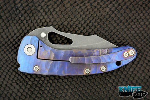 custom damjan eror small saurus knife, blue purple anodized sculpted titanium handle, aside washed 3v blade steel