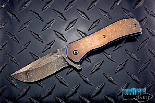 custom doc shiffer recon knife, heat colored bronzed damascus blade, antique damascus overlay, blue anodized titanium liners, zirconium pocket clip