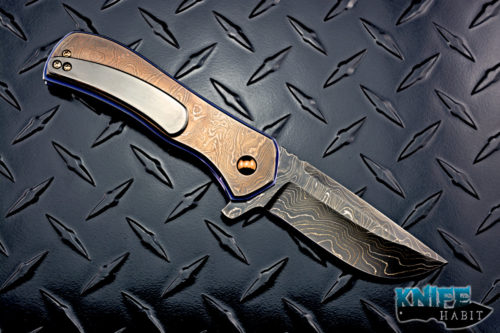 custom doc shiffer recon knife, heat colored bronzed damascus blade, antique damascus overlay, blue anodized titanium liners, zirconium pocket clip