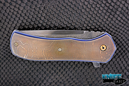 custom doc shiffer recon knife, heat colored bronzed damascus blade, antique damascus overlay, blue anodized titanium liners, zirconium pocket clip