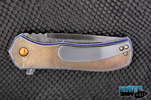 custom doc shiffer recon knife, heat colored bronzed damascus blade, antique damascus overlay, blue anodized titanium liners, zirconium pocket clip