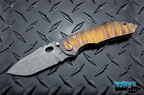 custom dalibor bergam sirius knife, sculpted blue and gold anodized titanium frame, acid washed 3v blade steel