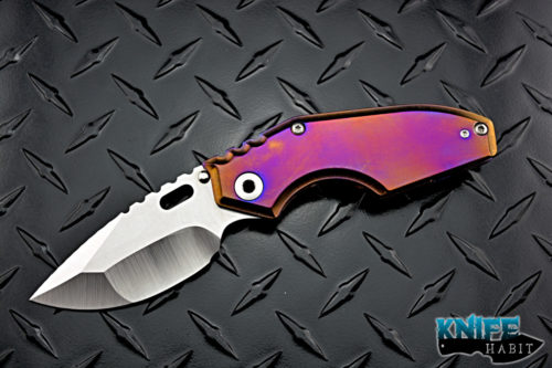 custom MSC mick strider jibble knife, satin nightmare grind, colorful purple blue bronze anodized titanium frame