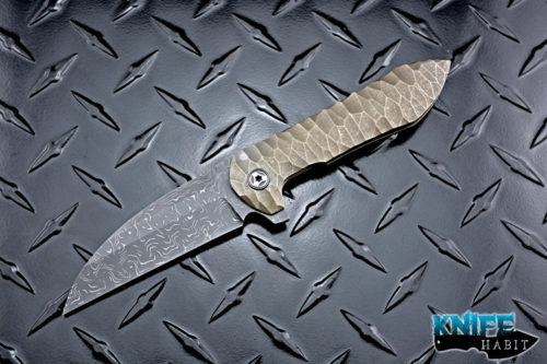 custom peter rassenti druid flipper knife, sculpted bronzed titanium integral frame, zirconium pivot collars, damascus blade