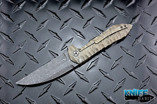 custom peter rassenti druid flipper knife, sculpted bronzed titanium integral frame, zirconium pivot collars, damascus blade