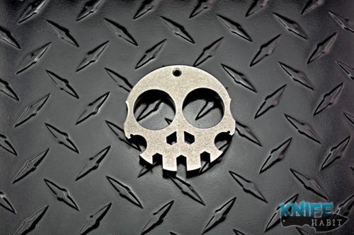 custom ooak forge skull multitool, titanium hand ground edges stonewashed