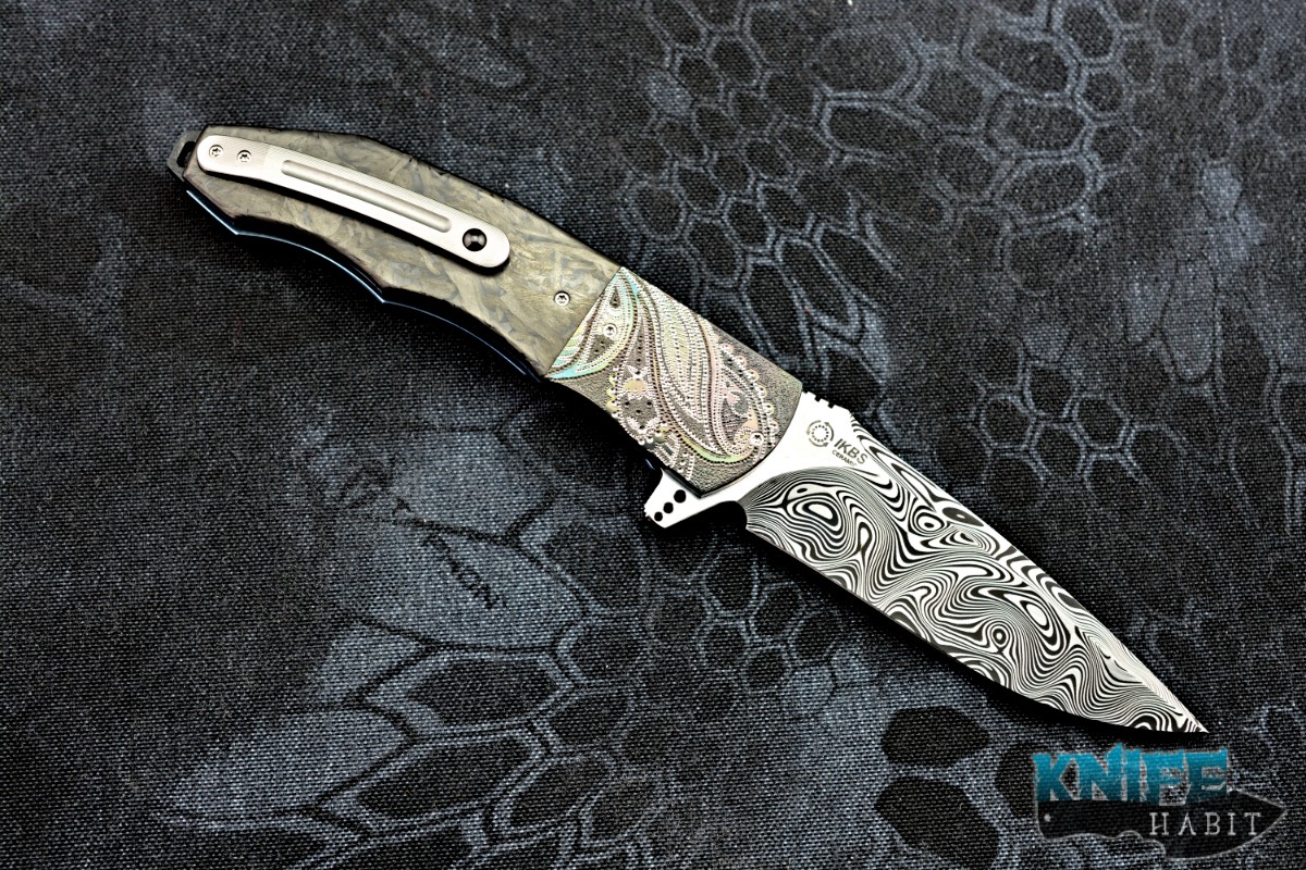 https://knifehabit.com/wp-content/uploads/2018/05/andre-thorburn-l53-damasteel-engraved-zirconium-marbled-carbon-fiber-custom-knife-02.jpg