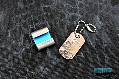 custom steel flame jewelry molle clip, blue paper mache cranes, steel flame koi fish dog tag